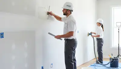 Drywall repair specialists restoring damaged walls in Greensboro, NC homes and businesses